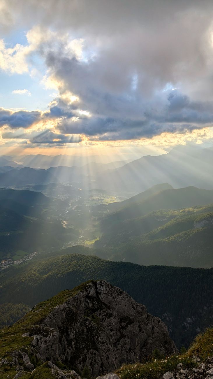 stunning mountain view with sun rays in the alps